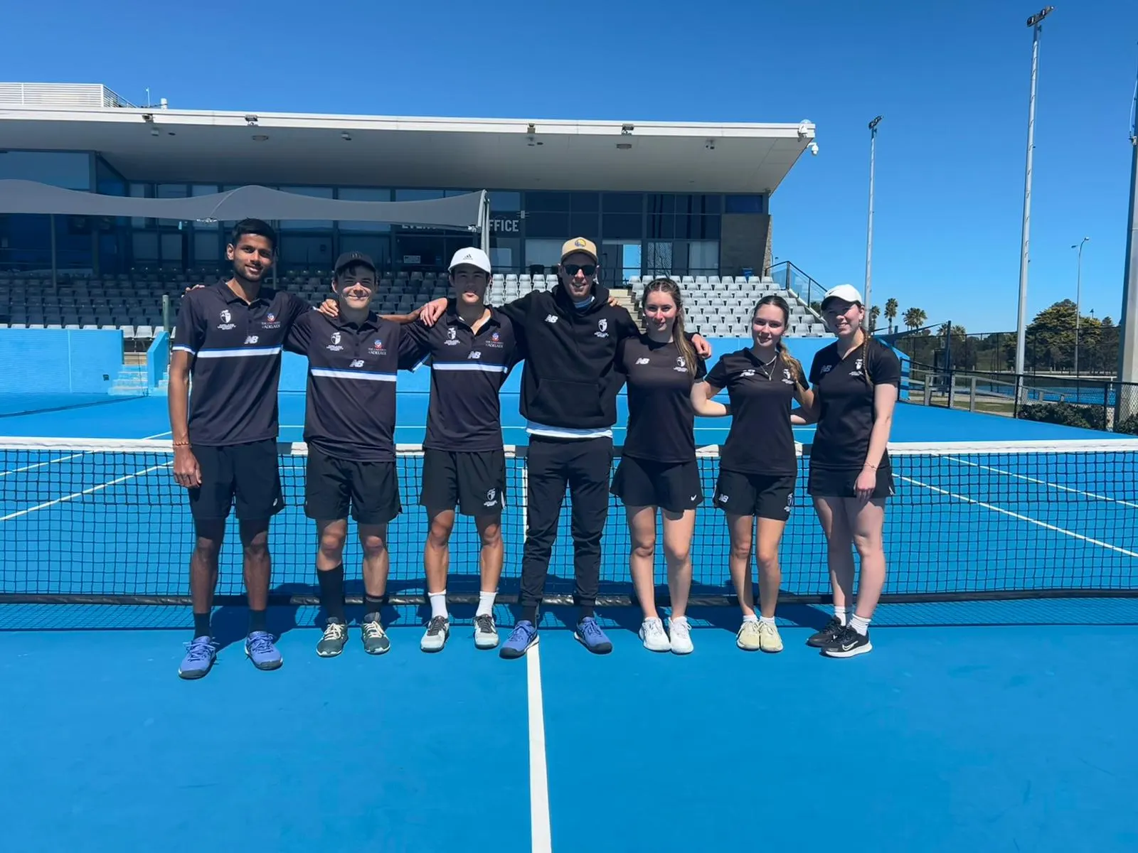 Adelaide University tennis team at the net