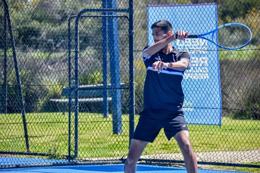 Agrim hitting a forehand