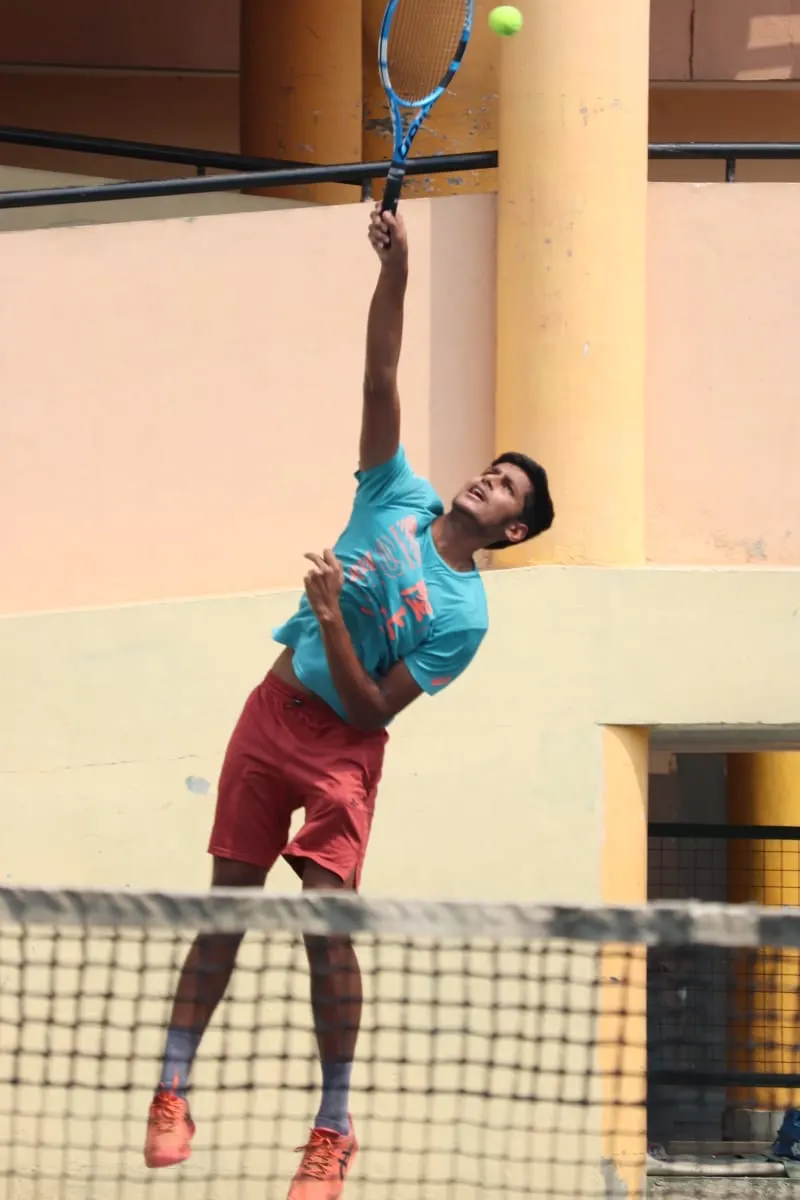 Agrim serving in a school match