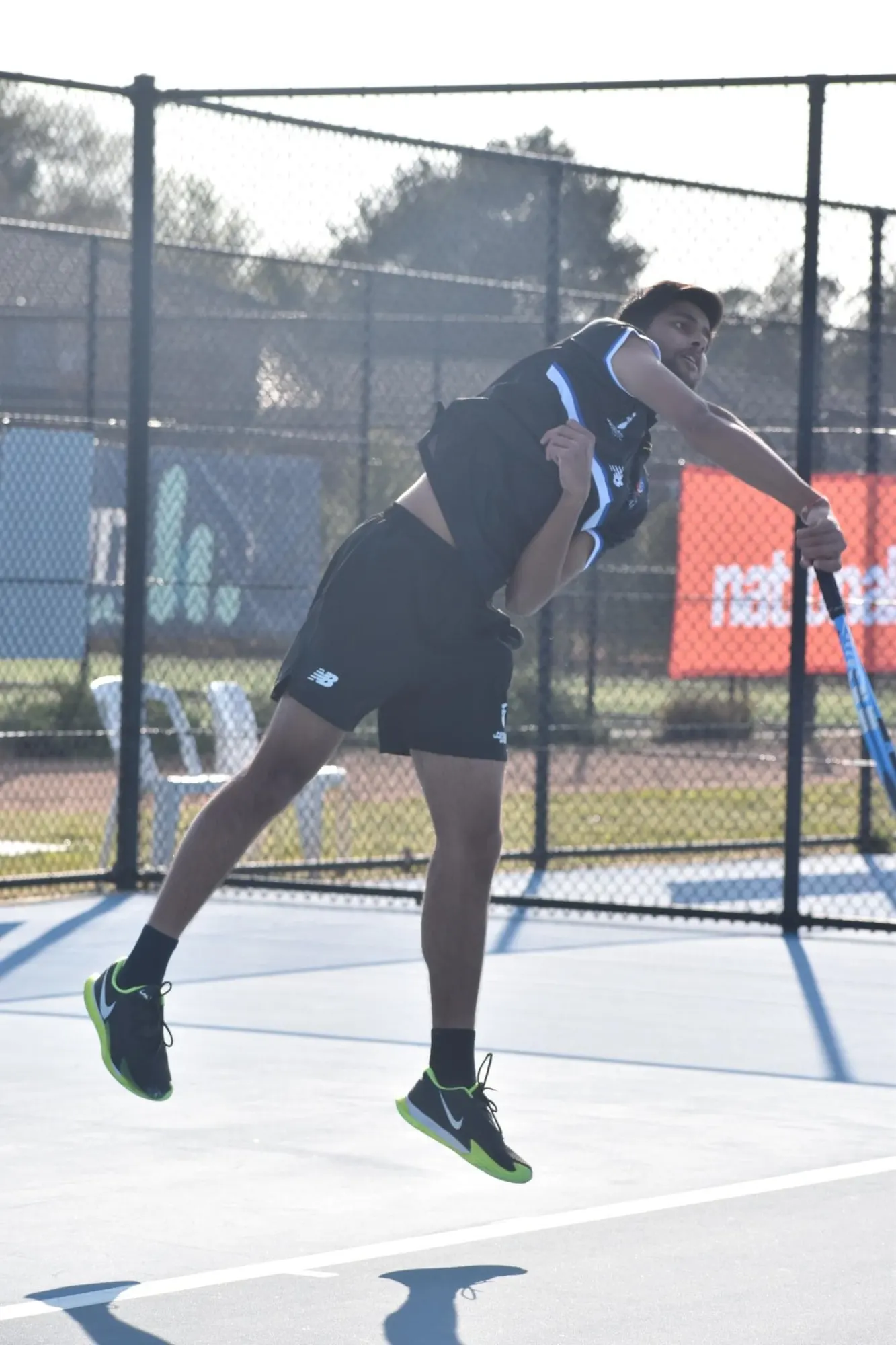 Agrim jumping into a serve at UniSport Nationals in Canberra