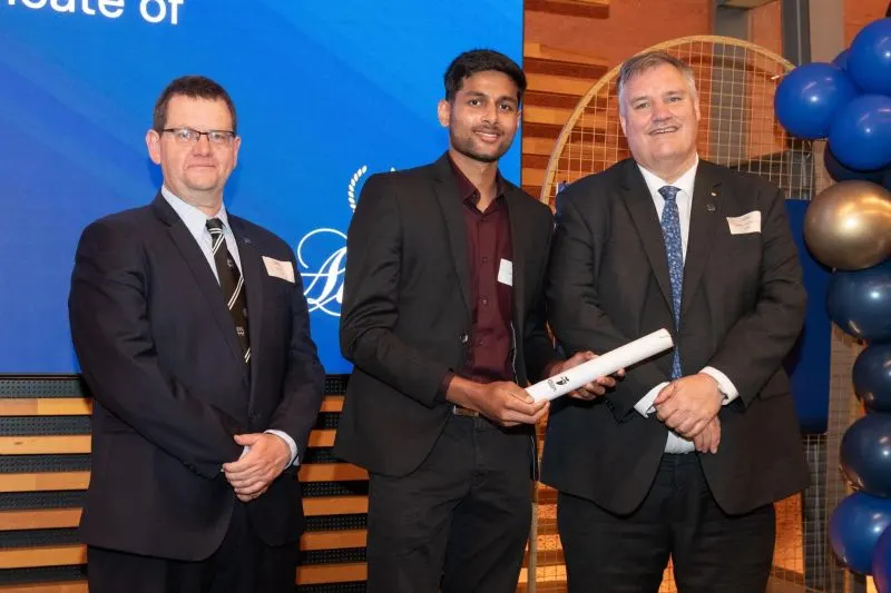 Agrim receiving a certificate on stage