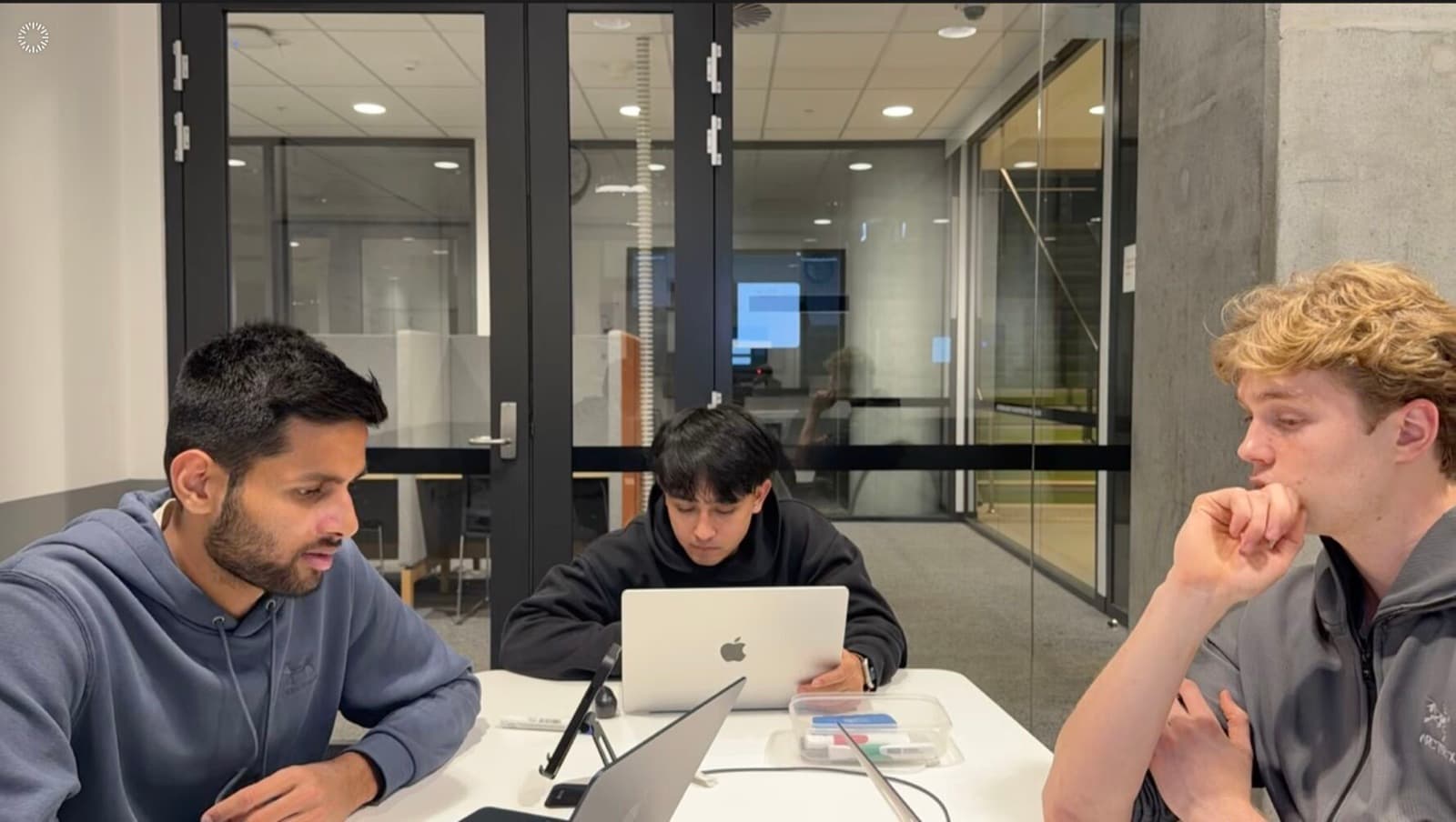 The three-university team building during the 44-hour hackathon